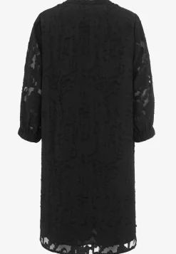 Jacquard-neuloksinen, läpikuultava mekko