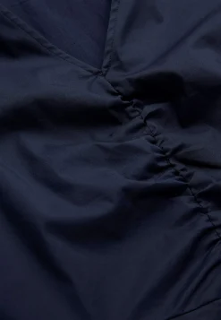 Mekko popliinista taskuilla
