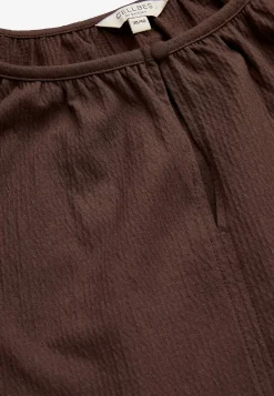 Toppi rypytetystä puuvillajersey-kankaasta