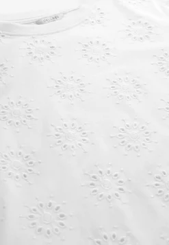 Trikootoppi kirjaillulla rei’ityksellä