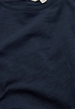 Trikootoppi lyhyillä hihoilla
