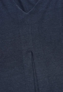 Trikootunika laskosdetaljilla